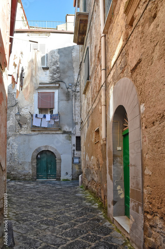 A small street among the old houses of Sessa Aurunca, a medieval village in the province of Caserta © Giambattista