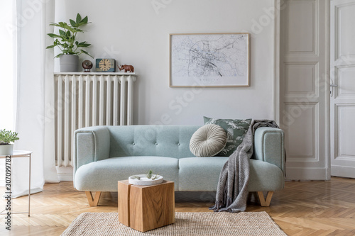 Stylish scandinavian living room interior with design mint sofa, furnitures, mock up poster map, plants, and elegant personal accessories. Home decor. Interior design. Template. Ready to use.  photo