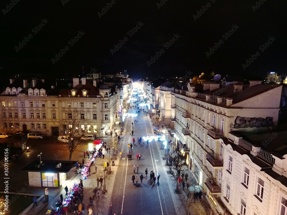 Obraz premium Gediminas' tower and Vilnius downtown at night. Drone footage.