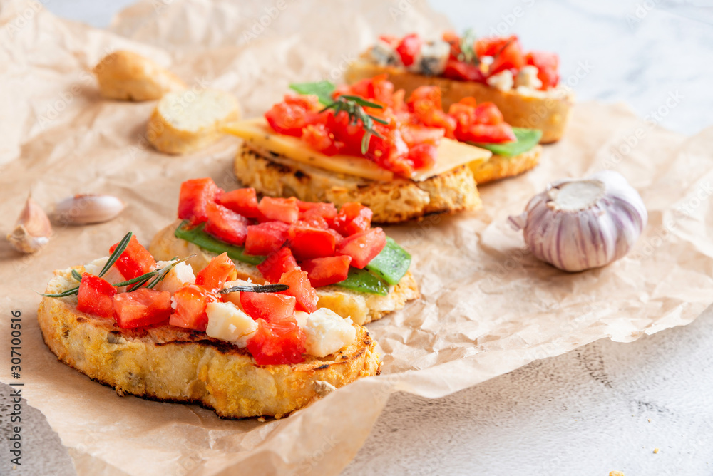 Italian bruschetta with cheese and tomatoes Italian bruschetta with cheese and tomatoes
