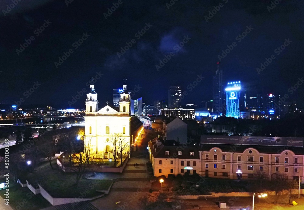 Fototapeta premium Gediminas' tower and Vilnius downtown at night. Drone footage.