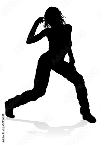 A woman street dance hip hop dancer in silhouette