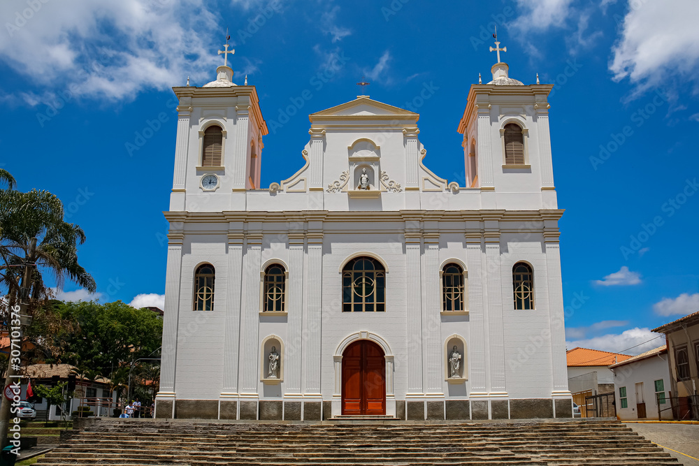 Front view of a white colonial church on a sunny day in historic town São Luíz do Paraitinga, Brazil