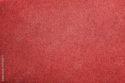 Closeup red color fabric sample texture backdrop. Fabric for decoration interior design or abstract background.