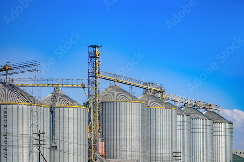 Cuadro en lienzo Agricultural Silos ,Industrial silos Storage and drying of grains with Blue Sky