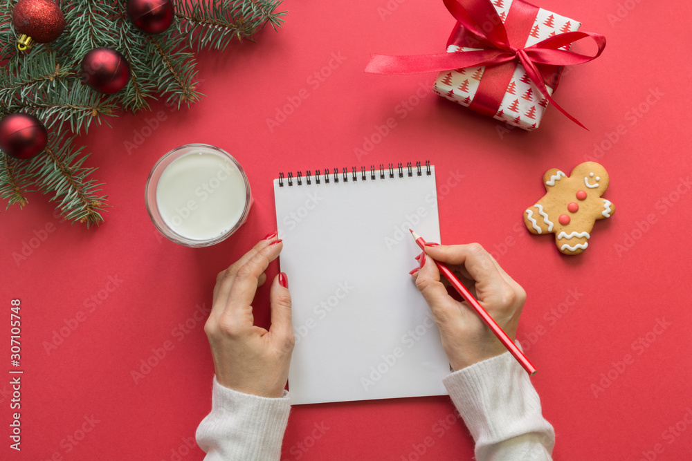 Christmas invitation with milk, cookies, gingerbread on red.Top view and space for your text. Flat lay.
