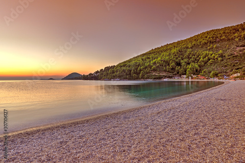 The sunset at the beach Panormos of Skopelos, Greece photo