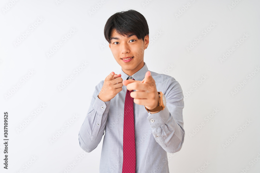 Chinese businessman wearing elegant tie standing over isolated white background pointing fingers to camera with happy and funny face. Good energy and vibes. Chinese businessman wearing elegant tie standing over isolated white background pointing fingers to camera with happy and funny face. Good energy and vibes.