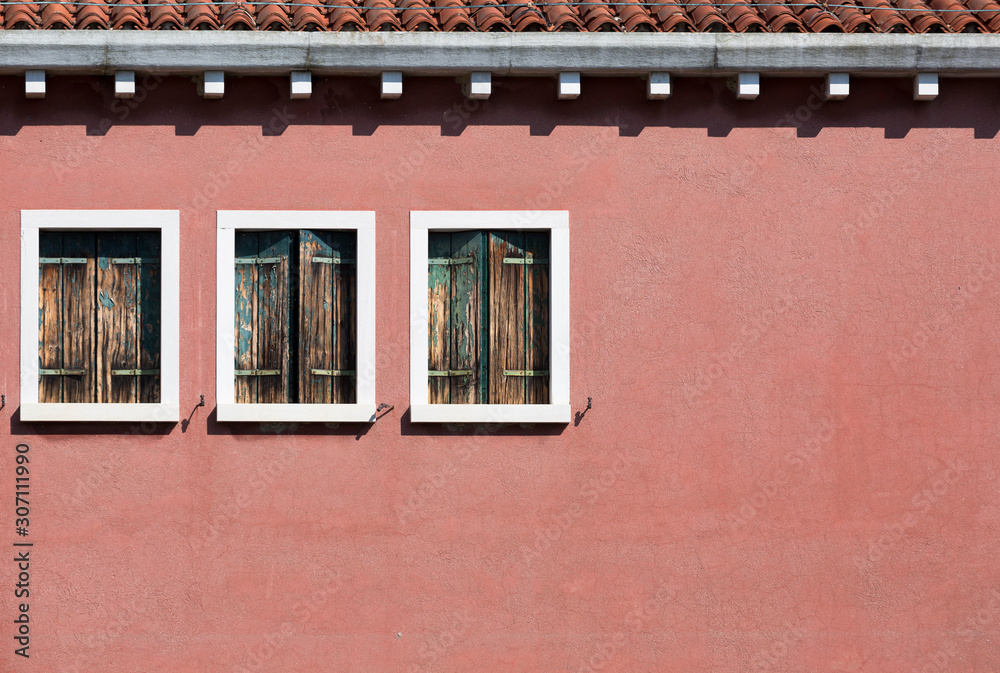 Color old wall with three windows