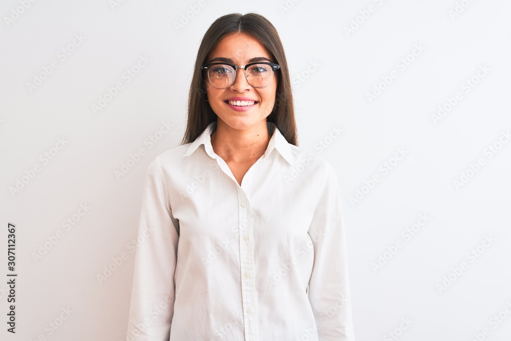 Young beautiful businesswoman wearing glasses standing over isolated white background with a happy and cool smile on face. Lucky person.