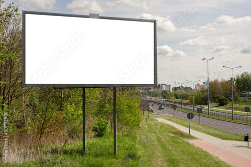 Blank billboard for advertisement with the city street in the background