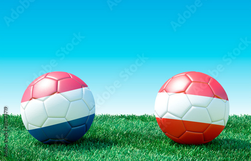 Two soccer balls in flags colors on green grass. Netherlands and Austria. 3d image