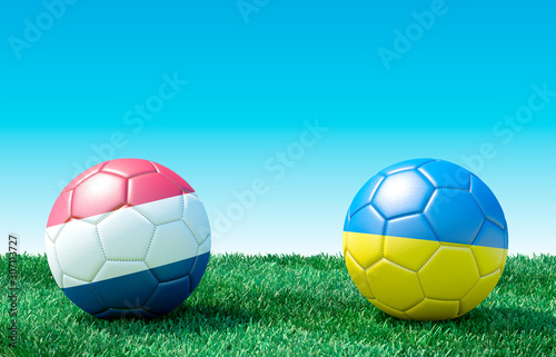 Two soccer balls in flags colors on green grass. Netherlands and Ukraine. 3d image
