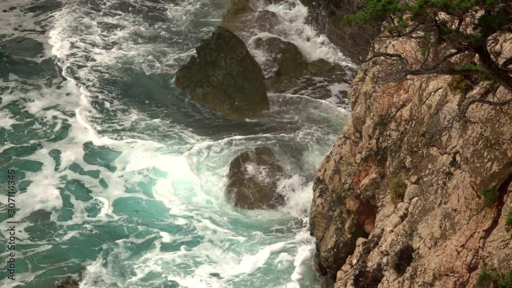 big waves on rocky coast and blue sea, in a autumn cloudy day big waves on rocky coast and blue sea, in a autumn cloudy day