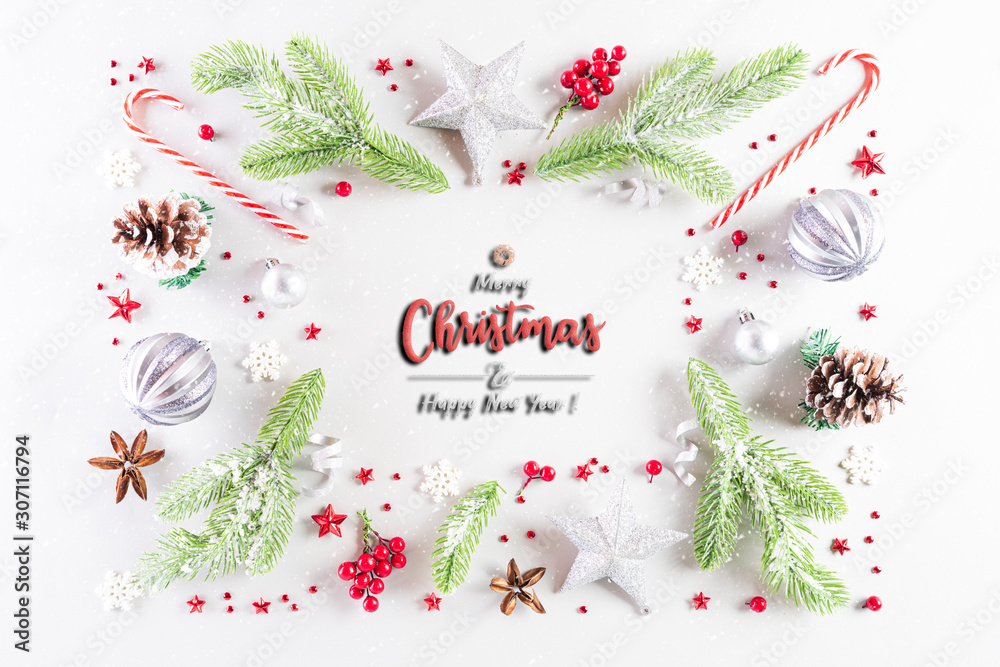 Fototapeta premium Christmas holidays composition Top view of gift box with Christmas tree decoration and red berries on white background with copy space for text.