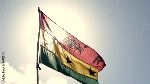 Rastafarian Flag waving in the afternoon sun. photo