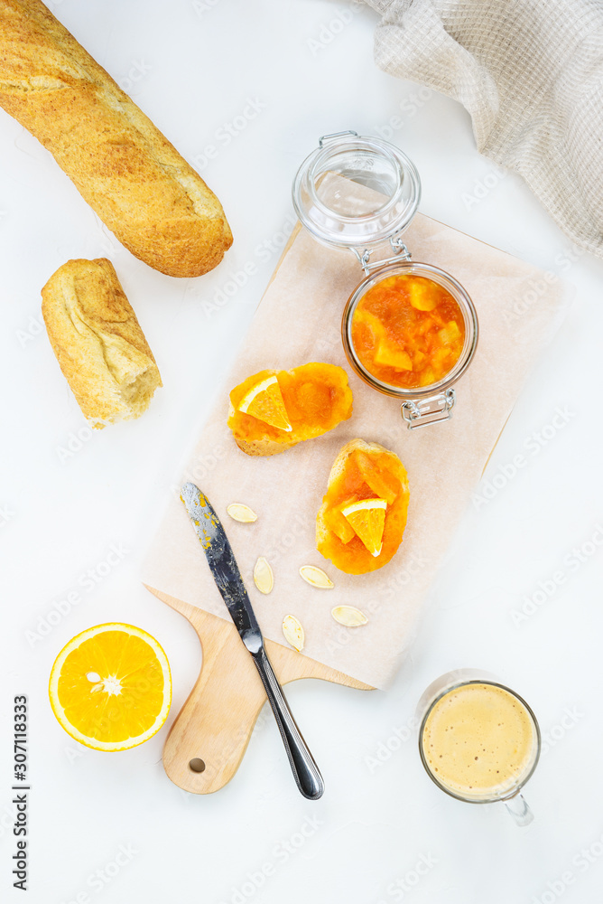 Sandwiches with pumpkin and orange jam on a wooden board. Sandwiches with pumpkin and orange jam on a wooden board.