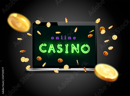 The blue neon word Casino. Coins are falling from the laptop. The big jackpot. You are the winner