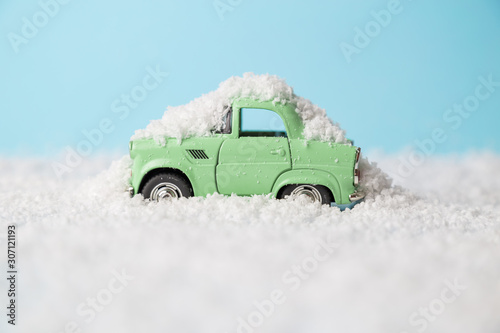 Car stuck in snow. Winter blizzard minimal creative winter season and transportation concept.