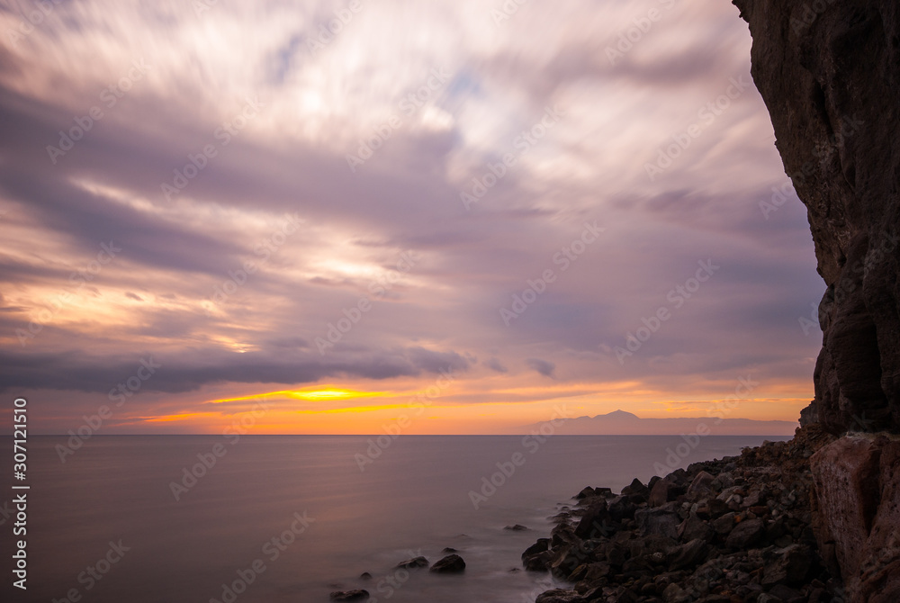 Fototapeta Sunset over the volcano Teide, Tenerife, seen from Puerto de Mogán, Gran Canaria