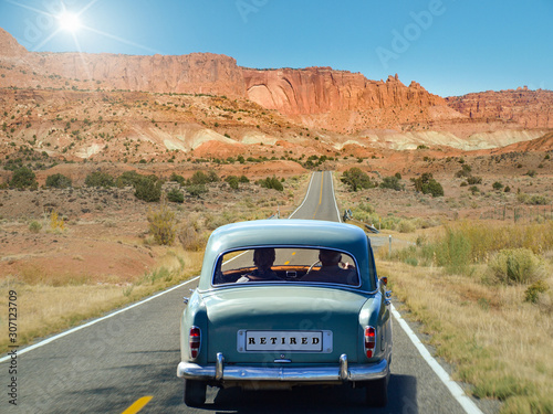 Oldtimer with old couple driving in retirement