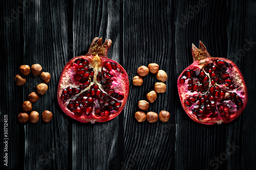 Healthy holidays food and diet. Number 2020 made from fruits and nuts. New Year and Christmas 2020 decisions about a healthy lifestyle.
