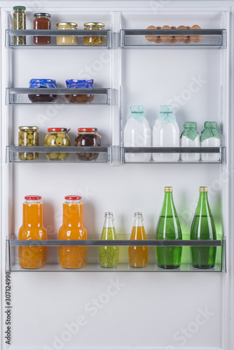 Open fridge full of fresh fruits and vegetables