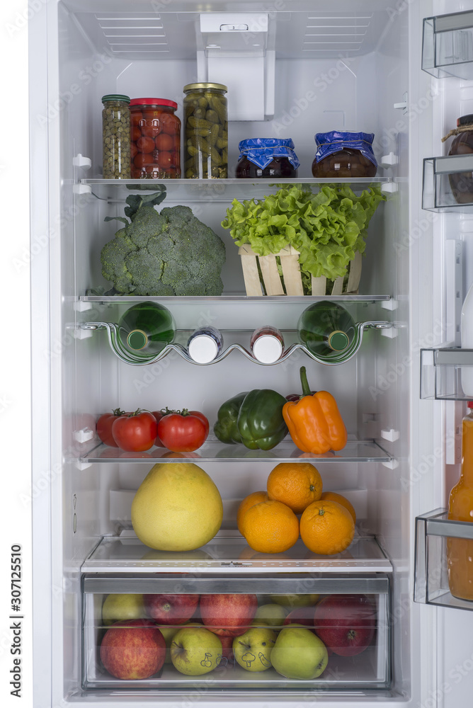 Open fridge full of fresh fruits and vegetables Open fridge full of fresh fruits and vegetables