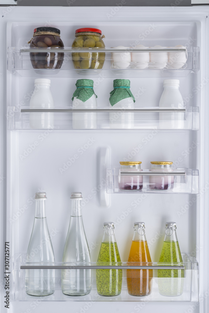 Open fridge full of fresh fruits and vegetables Open fridge full of fresh fruits and vegetables