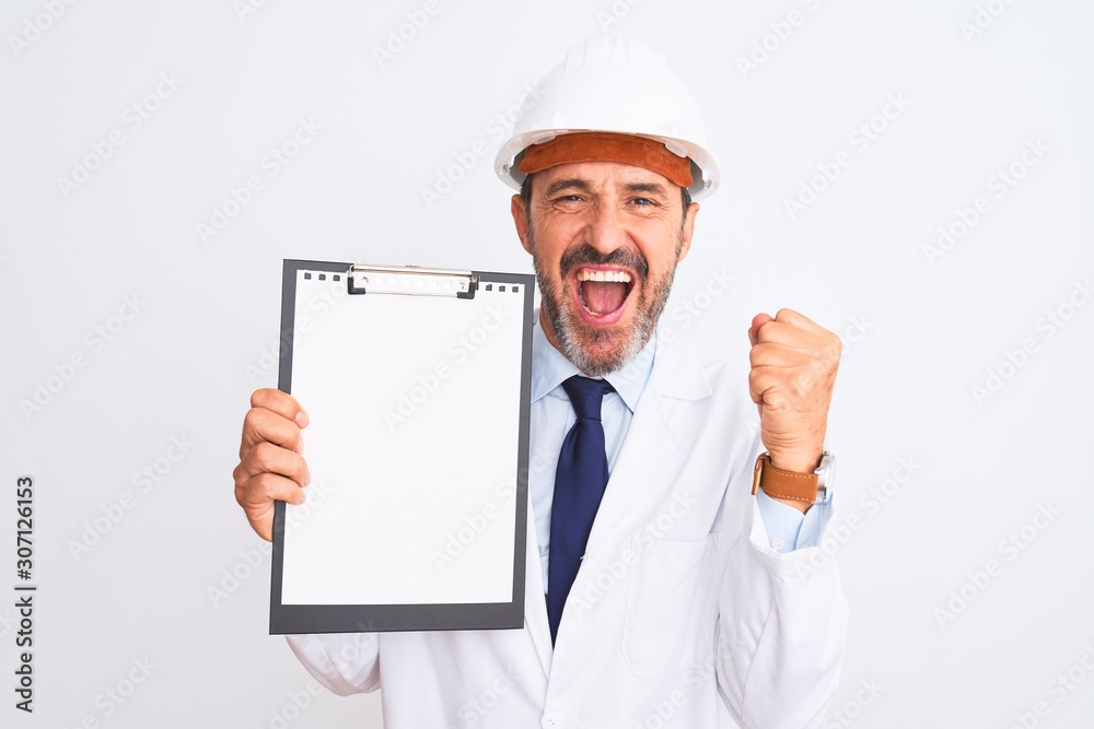 Senior engineer man wearing security helmet holding clipboard over isolated white background screaming proud and celebrating victory and success very excited, cheering emotion Senior engineer man wearing security helmet holding clipboard over isolated white background screaming proud and celebrating victory and success very excited, cheering emotion