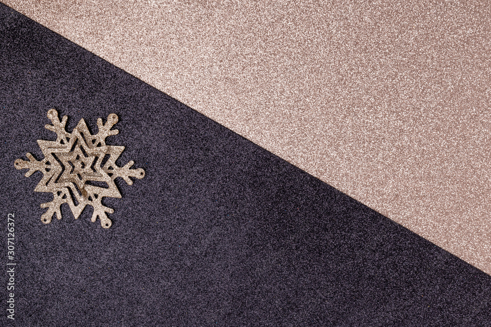 New Year and Christmas greeting card made of golden Christmas decorations on black and golden shining background. Top view, flat lay, copy space New Year and Christmas greeting card made of golden Christmas decorations on black and golden shining background. Top view, flat lay, copy space