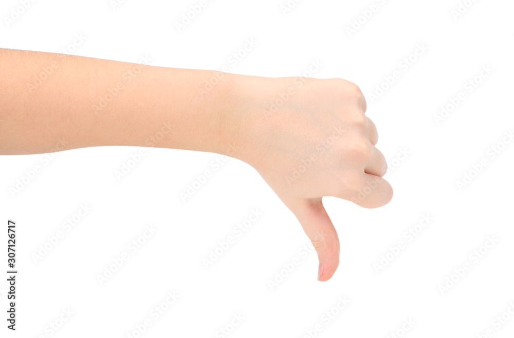child hand shows thumb down isolated on white background, negative concept. child hand shows thumb down isolated on white background, negative concept.
