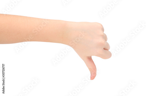 child hand shows thumb down isolated on white background, negative concept.