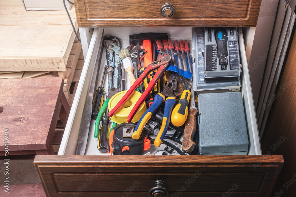 Various tools in the drawer in the workshop