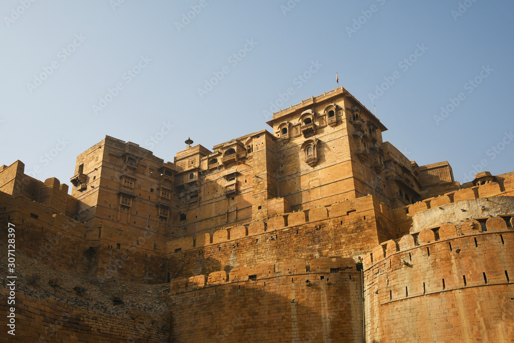 Stone walls of fortification and viewing windows carved in walls at Golden Fort, Jaisalmer, Rajasthan, India