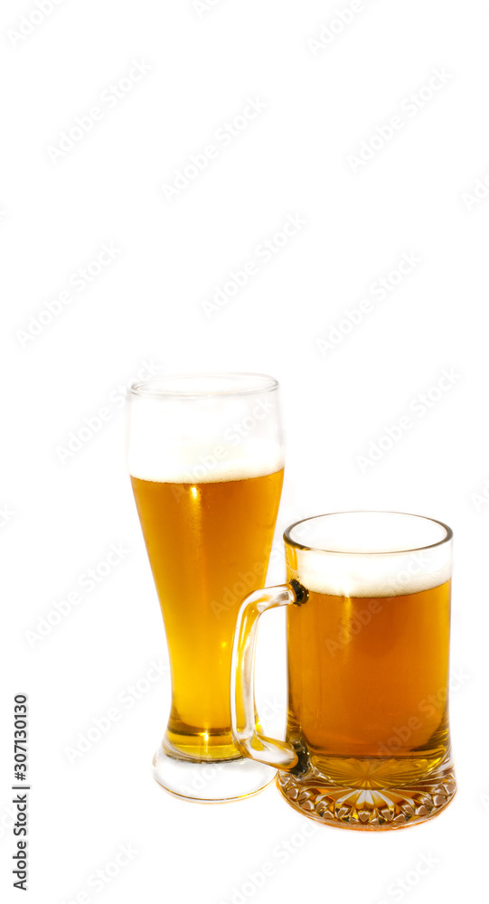 A mug and a glass of light beer on a white background A mug and a glass of light beer on a white background