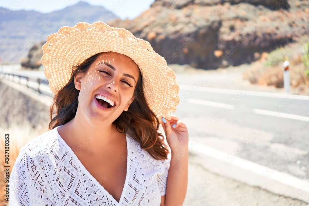Young beautiful tourist woman smiling happy enjoying summer vacation on a road trip