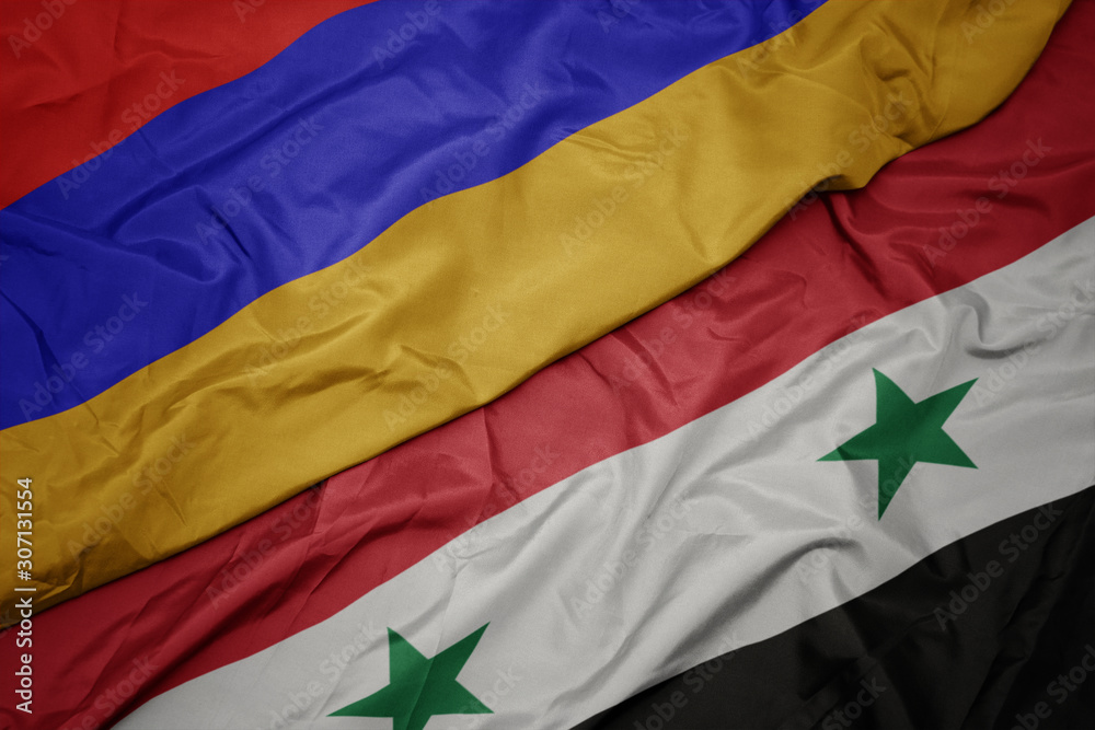 waving colorful flag of syria and national flag of armenia.