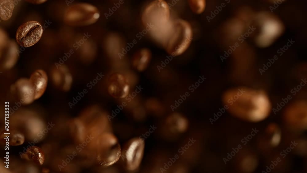 Super slow motion of flying coffee beans. Filmed on high speed cinema camera, 1000 fps. 4K UHD Super slow motion of flying coffee beans. Filmed on high speed cinema camera, 1000 fps. 4K UHD