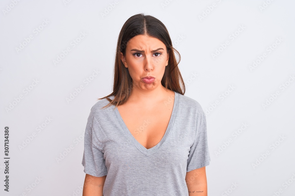Portrait of beautiful young woman standing over isolated white background depressed and worry for distress, crying angry and afraid. Sad expression. Portrait of beautiful young woman standing over isolated white background depressed and worry for distress, crying angry and afraid. Sad expression.