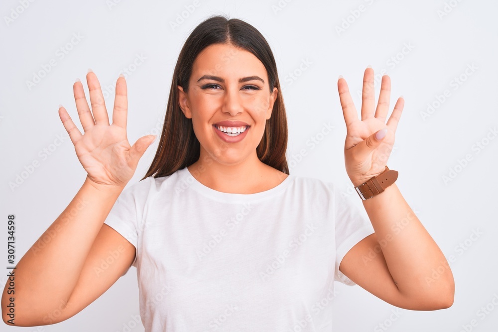 Portrait of beautiful and young brunette woman standing over isolated white background showing and pointing up with fingers number nine while smiling confident and happy. Portrait of beautiful and young brunette woman standing over isolated white background showing and pointing up with fingers number nine while smiling confident and happy.
