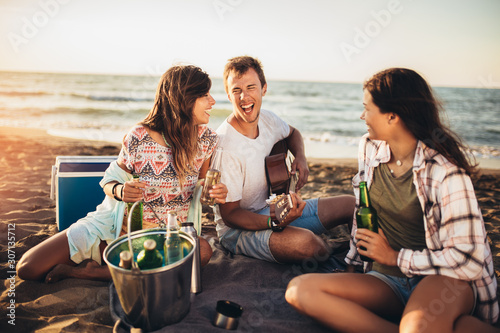 Friends having fun at the beach on a sunny day.