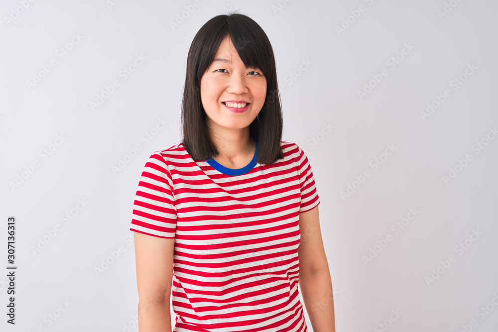 Young beautiful chinese woman wearing red striped t-shirt over isolated white background looking away to side with smile on face, natural expression. Laughing confident. Young beautiful chinese woman wearing red striped t-shirt over isolated white background looking away to side with smile on face, natural expression. Laughing confident.