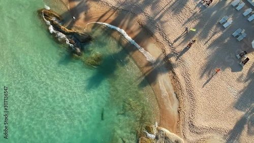Top down Aerial Drone Shot. Ocean coast. View of the sea waves, sandy beach, blue water. Travel to the island Koh Samui, Thailand. 