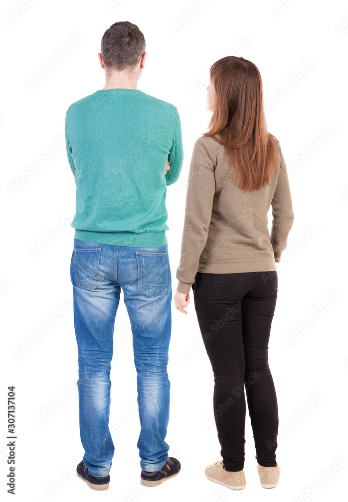 Back view of couple. beautiful friendly girl and guy together.