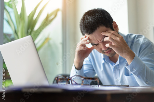 serious people frustrated exhausted work stress concept.businessman holding hands on face feeling tired suffering working on paperwork job in work place.concept global economic problems