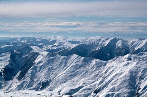 Mountain peaks covered with snow caps.