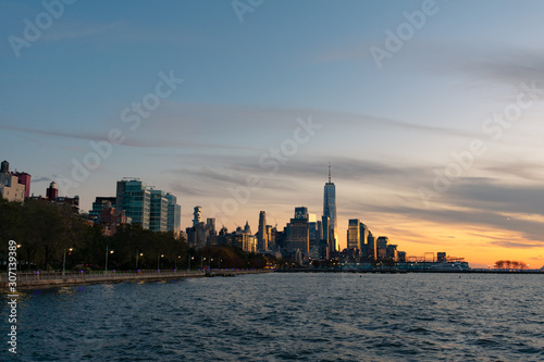 Shoreline of the Hudson River with the New York City Financial District Skyline during Sunset