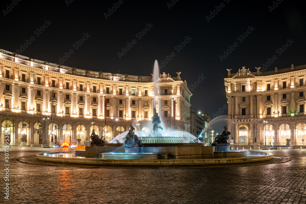 The Fountain of the Naiads and the Republic square in Rome at night.