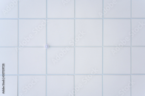 Fototapeta Naklejka Na Ścianę i Meble -  Squared background concept in white. Photo of the ceiling in the building.